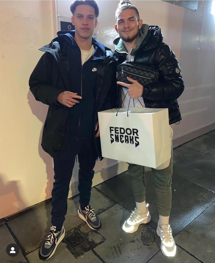 Liverpool wonderkid Harvey Elliot poses with Fedor after making a purchase