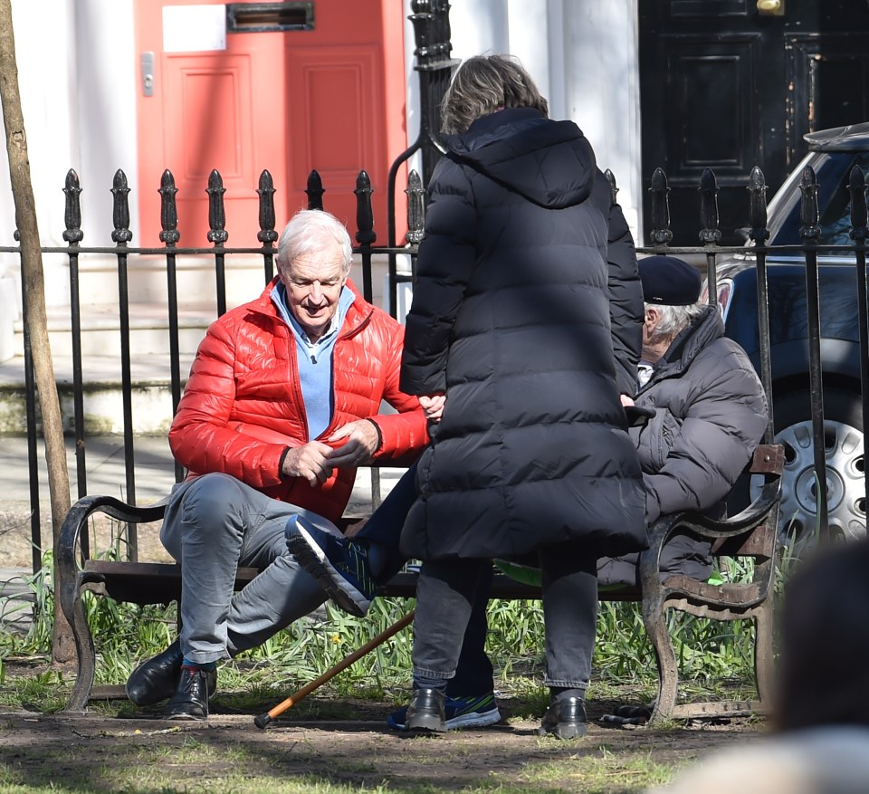 He stopped to chat with friends on a park bench