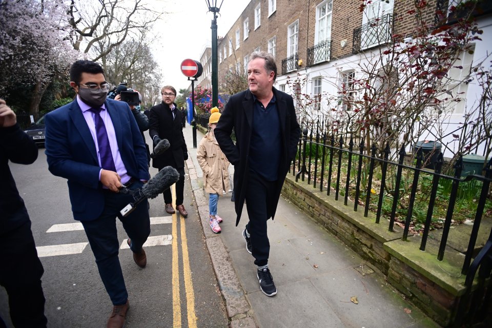 Piers dressed down in trainers as he chatted to the Press