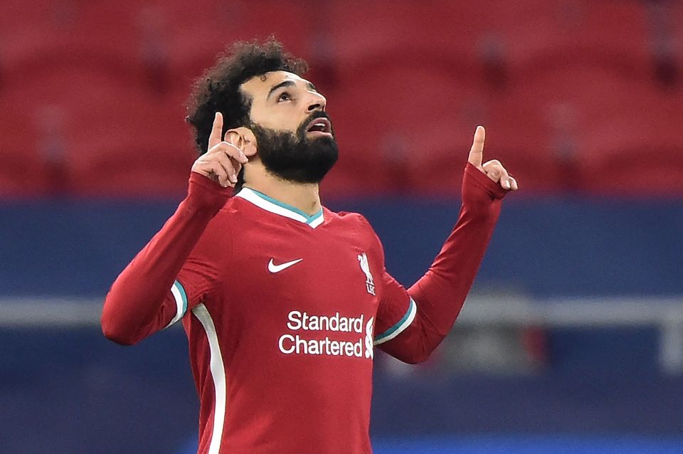 Mo Salah salutes his breakthrough goal as Liverpool put aside their Prem woes by making comfortable progress in the Champions League