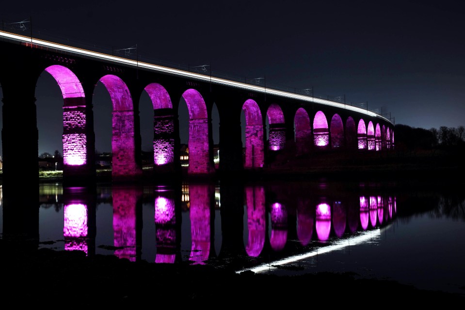 Royal Border Bridge in Northumberland is illuminated purple by the ONS