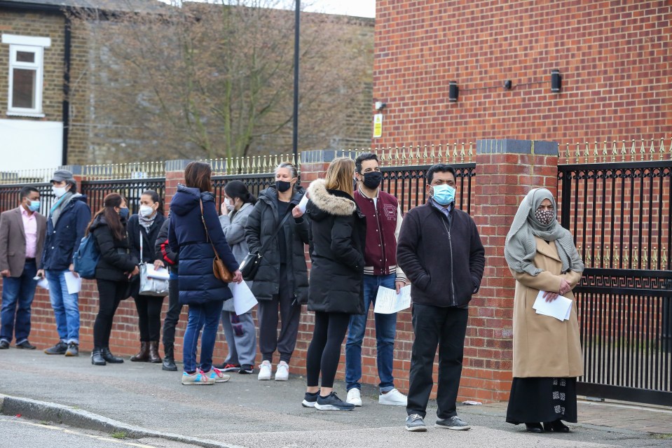 Members of the public queue outside Masjid Ayesha, a mosque in Tottenham, North London being used as a vaccination centre