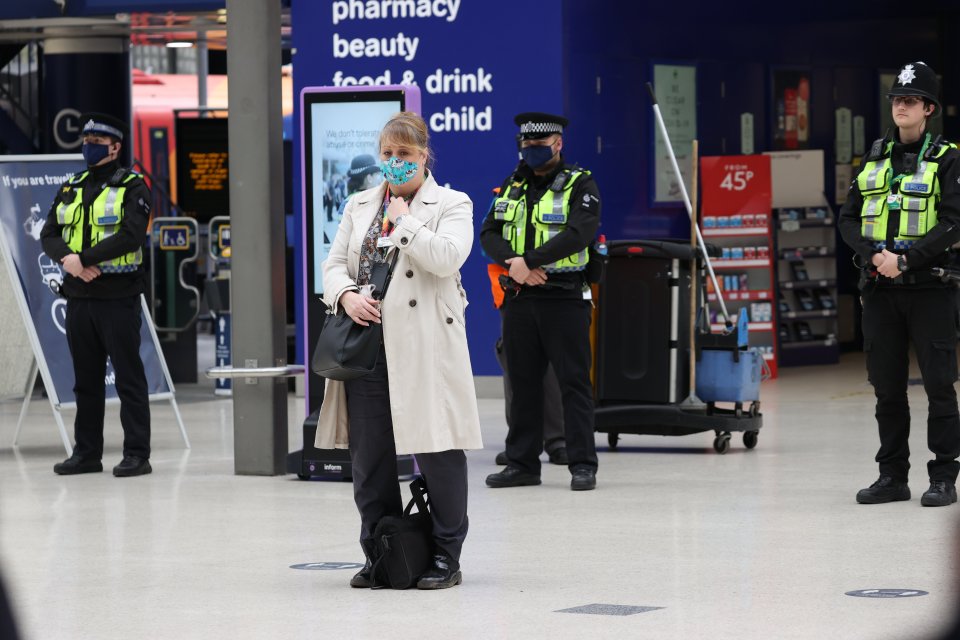 Brits at Waterloo Train Station in London mark the minute's silence