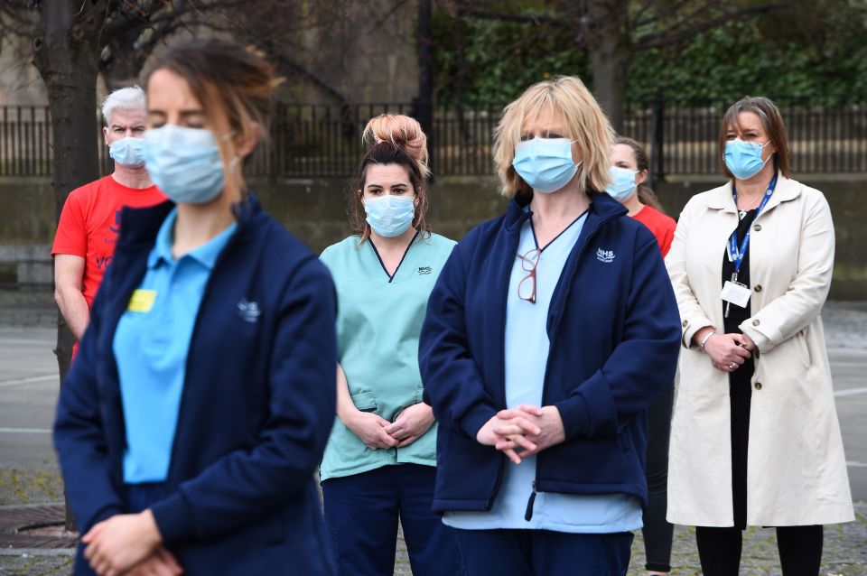 Health workers from the Glasgow Royal Infirmary take part in a minute's silence