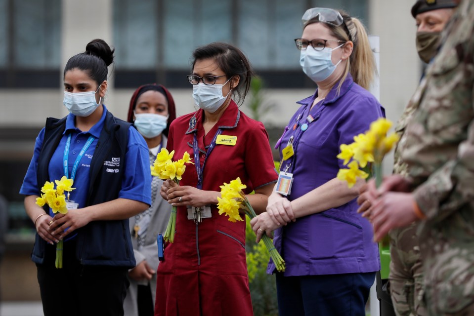 People across the country held a minute's silence for the victims of the pandemic