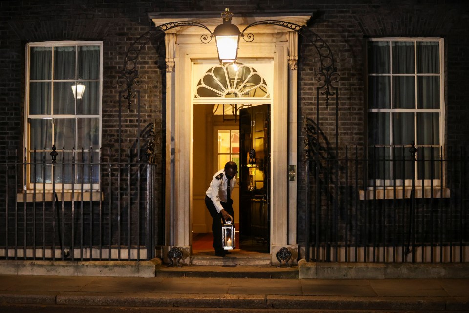 A candle is placed outside Downing Street to mark the day