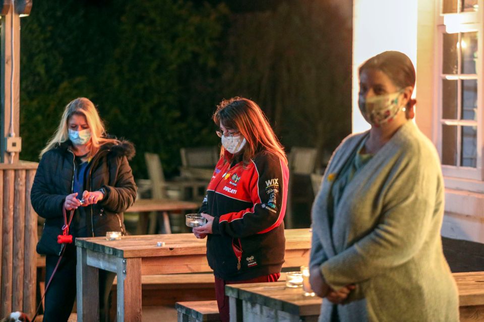 These women stood together as they commemorated the day nearby