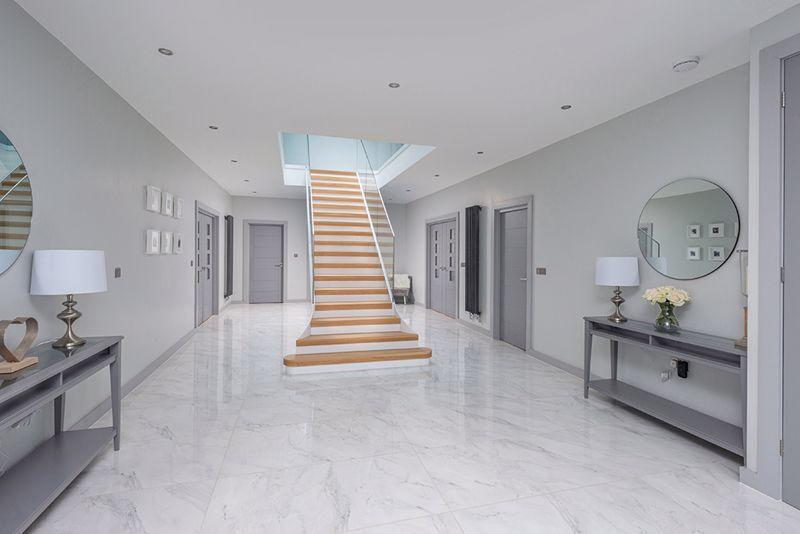 The stunning entrance is dominated by a staircase