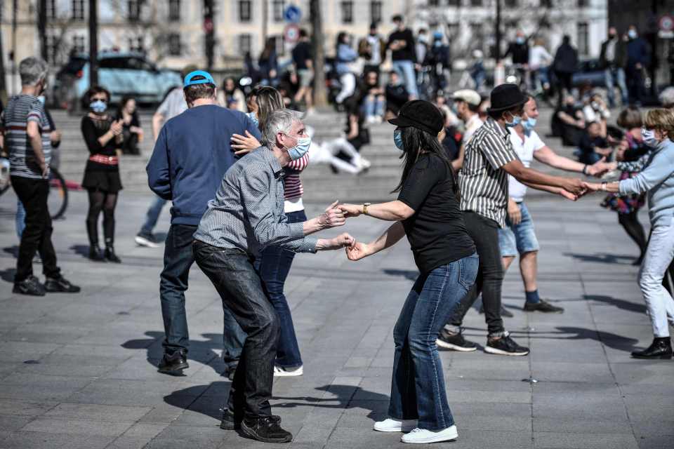 People danced hand-in-hand outside the Arab World Institute