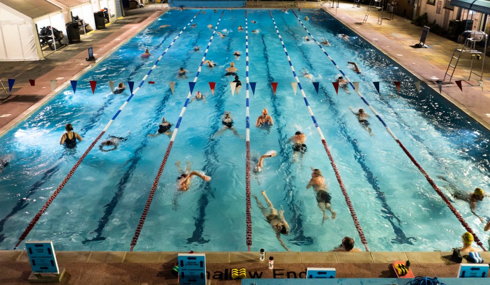 Swimmers made a splash at Hampton outdoor pool in south west London before dawn