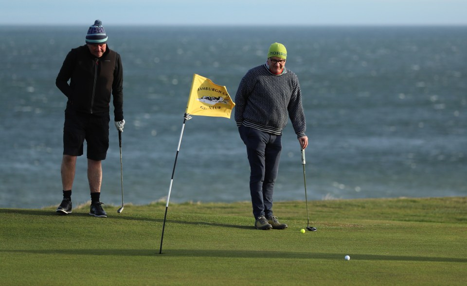 Members of the Bamburgh golf club played a round by the sea