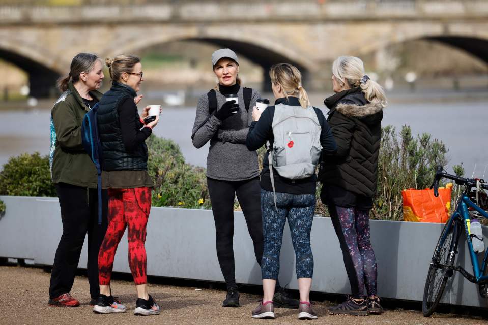 A small group chat over cups of coffee in Hyde Park in London