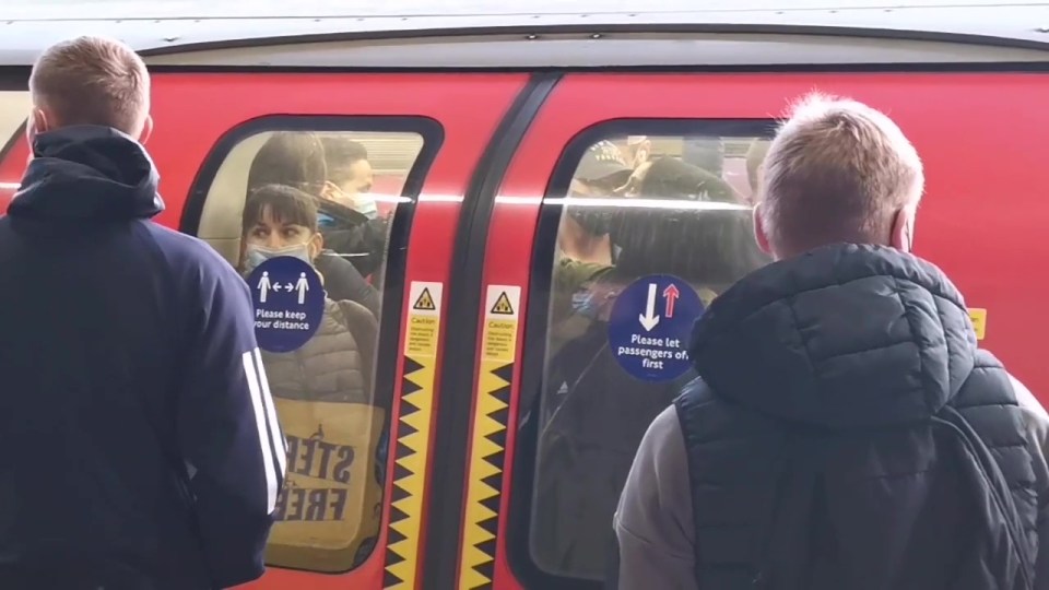 Passengers were squashed up against the doors as others waited on the platform