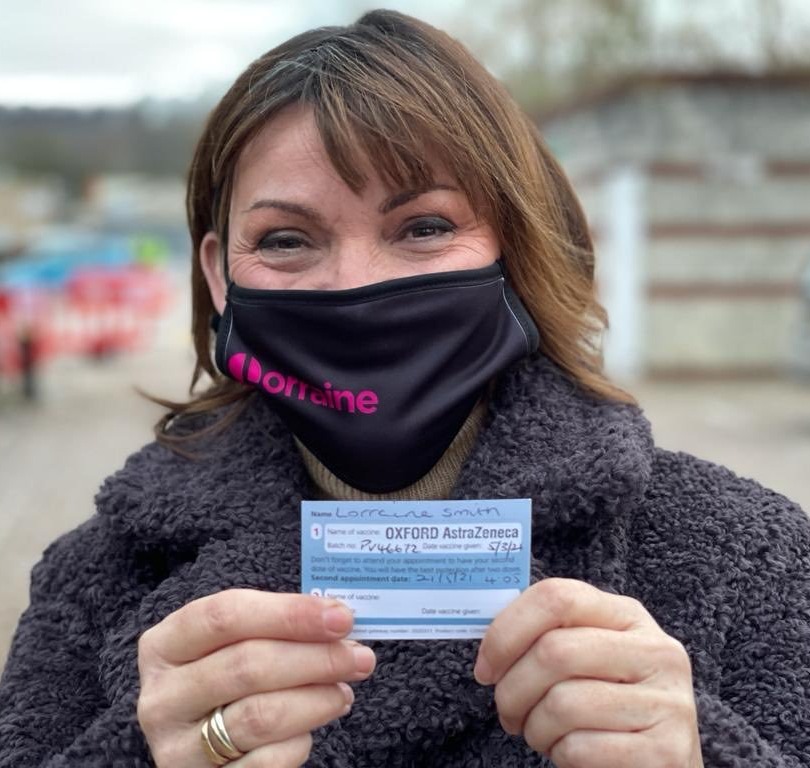 Lorraine Kelly posed with her coronavirus vaccination card yesterday