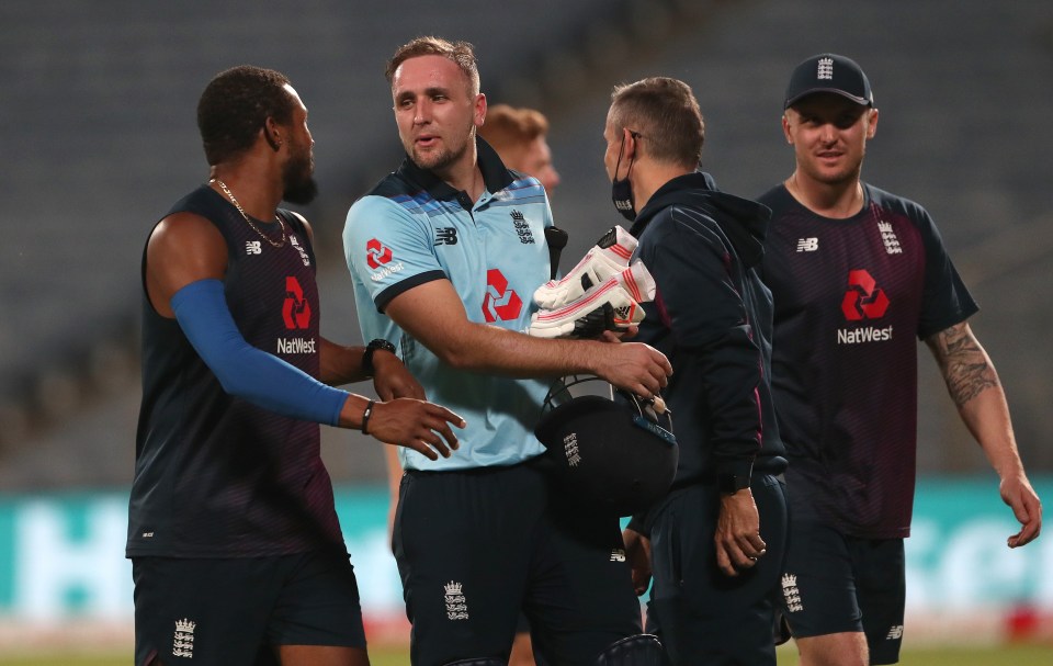 England batsman Liam Livingstone is congratulated by Chris Jordan on victory