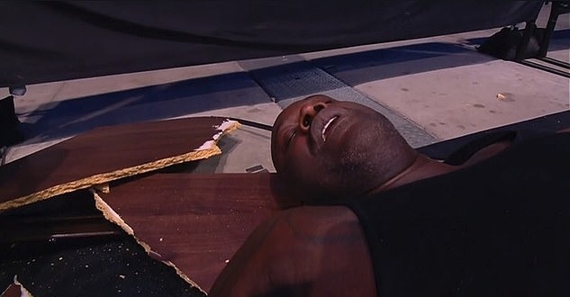 Shaq pictured on the floor after his table bump