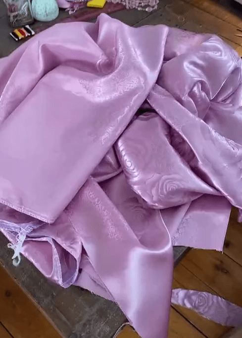 The star turned this pink tablecloth into a sexy cami top