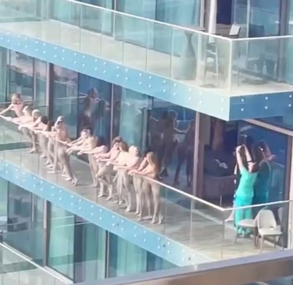 The models lined up on the balcony