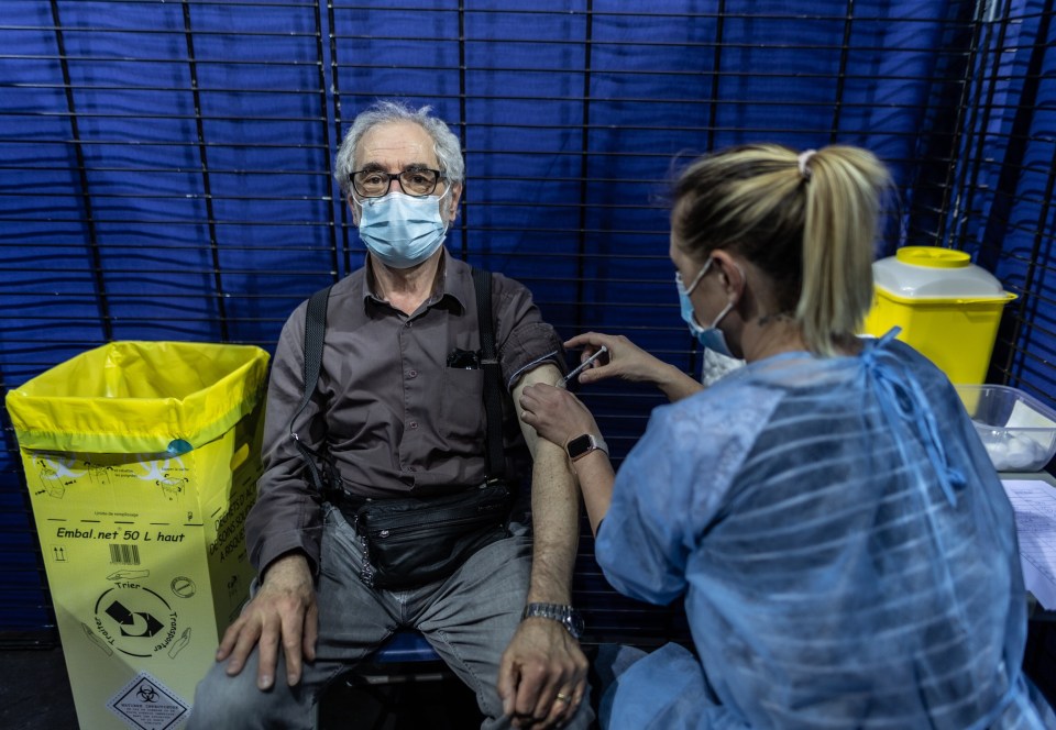 A man receiving the Pfizer vaccine in France