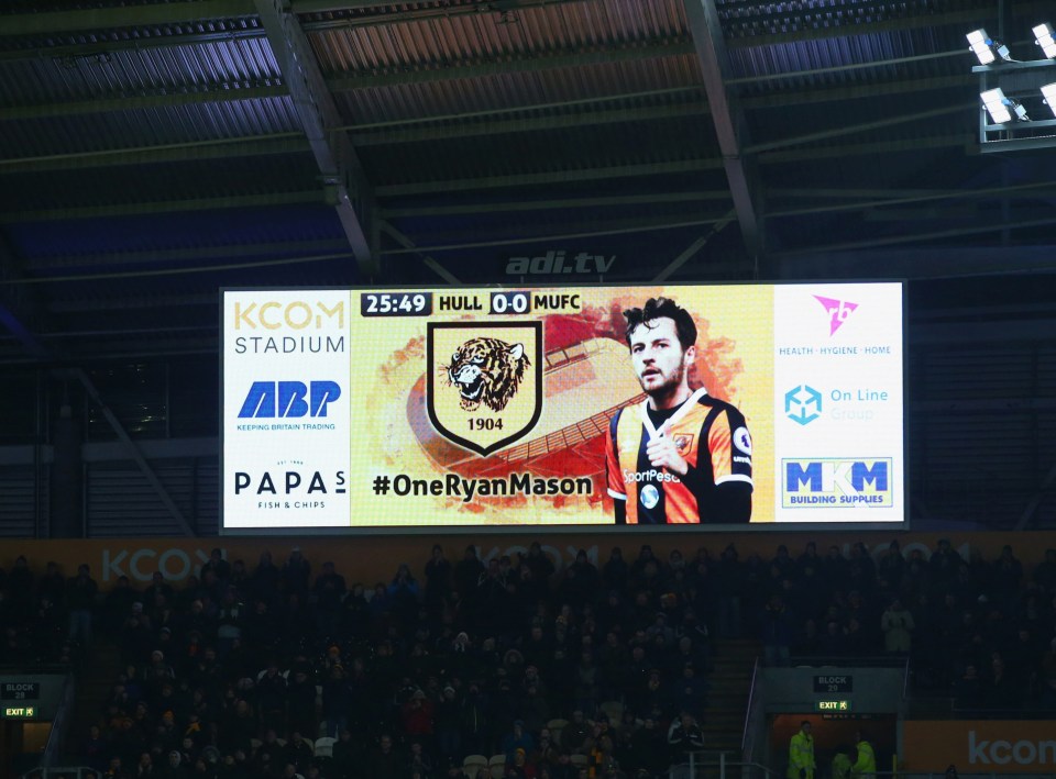 A scoreboard at KCOM Stadium shows its support for Mason