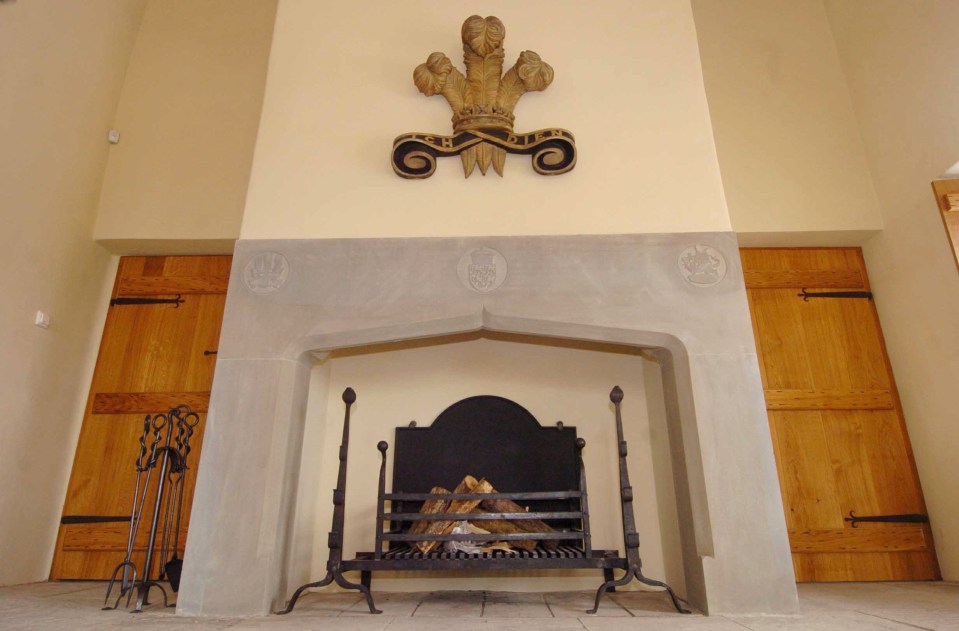 The home features a luxurious Welsh slate fireplace complete with Royal crest