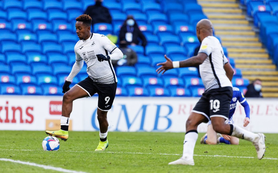 Jamal Lowe rolls his foot over the ball before scoring his stunner against Cardiff