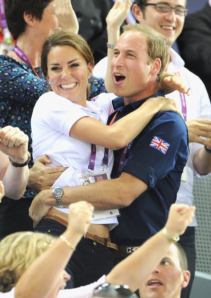 Going for hold . . . the couple at the London Olympics cycling event in August 2012