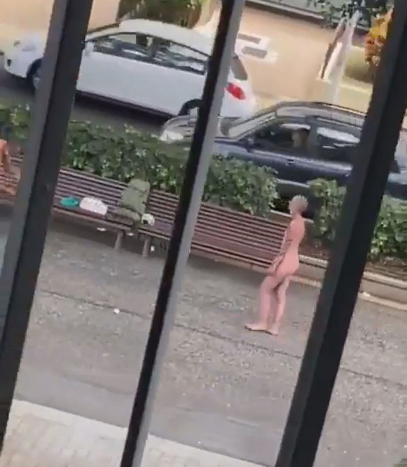 The couple were first seen chatting as the topless man was doing juggling tricks in front of the naked woman