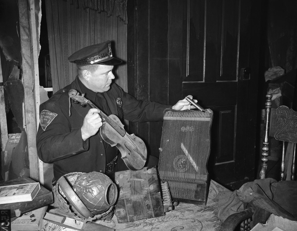 Police officer Dave Sharkey searches the house of horrors in 1957