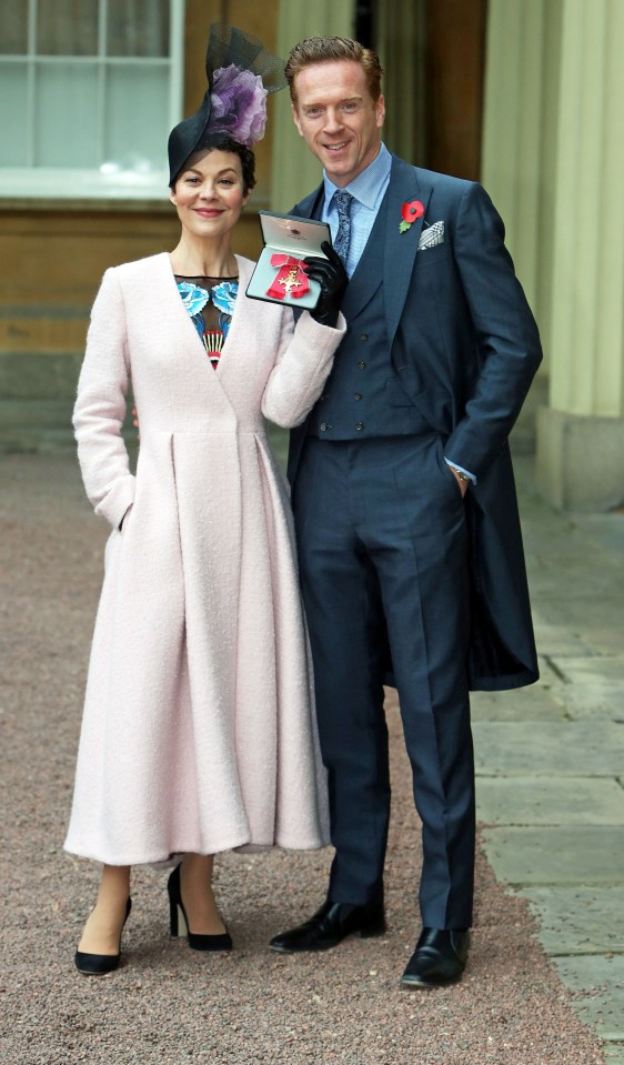 Helen beamed in 2017 with husband Damian Lewis outside Buckingham Palace picking up her OBE