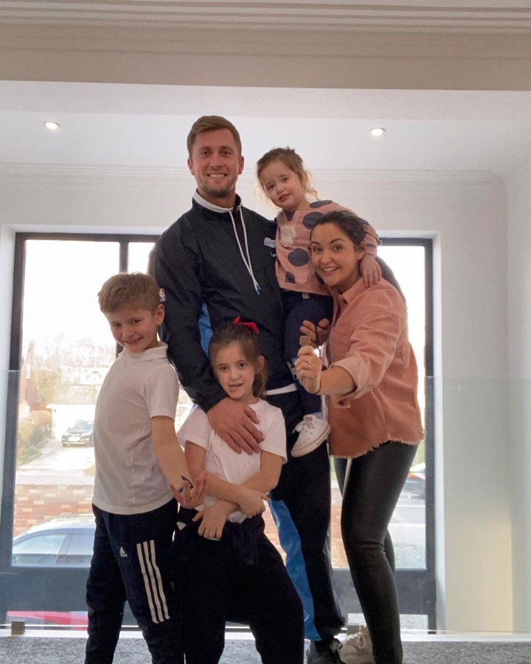 Jac and Dan with their daughters Mia and Ella, and Dan's son Teddy in their new home