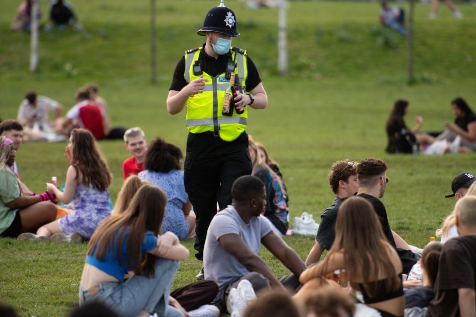 Police officers confiscate alcohol at the Forest Recreation Ground in Nottingham