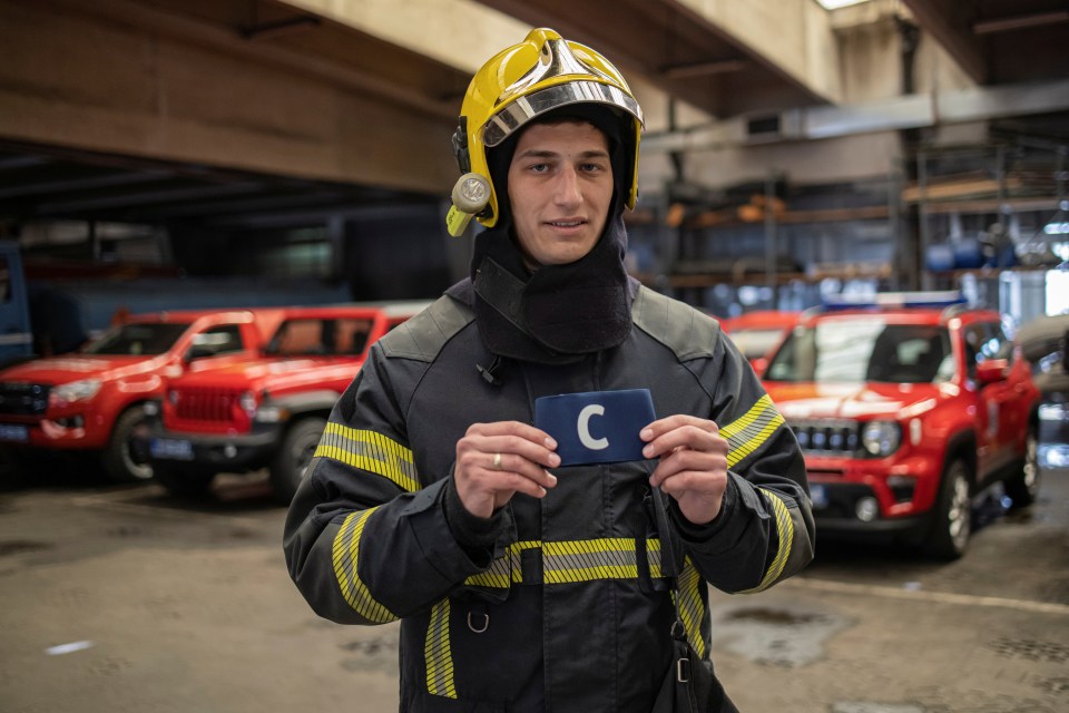 A Serbian firefighter posed with Cristiano's armband