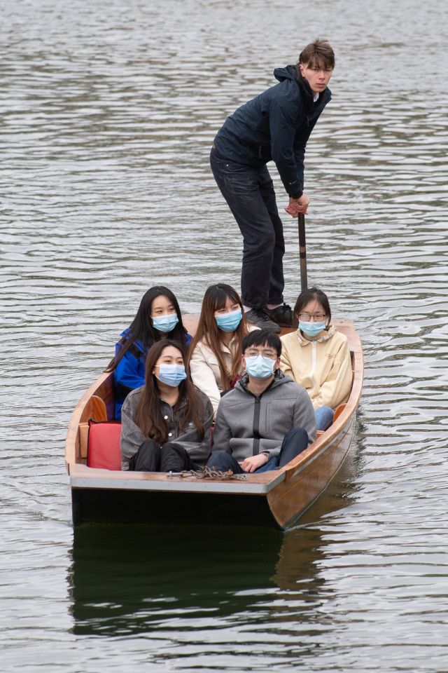 People take a punt tour along the River Cam in Cambridge