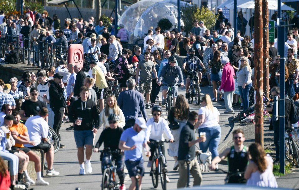 Crowds of people along the seafront at Mumbles, near Swansea