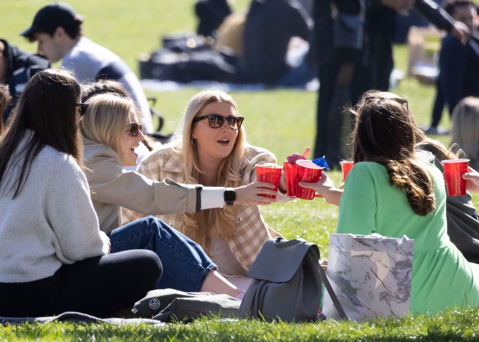 People relaxing in London's Battersea Park on Good Friday