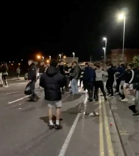 Video footage shows groups of male teenagers throwing punches and lobbing beer bottles at each other with no police presence around