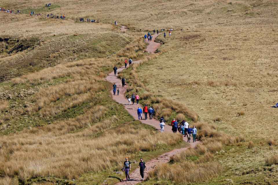 Walkers climb on the path leading to the summit of Pen-y-Fan in the Brecon Beacons, Wales