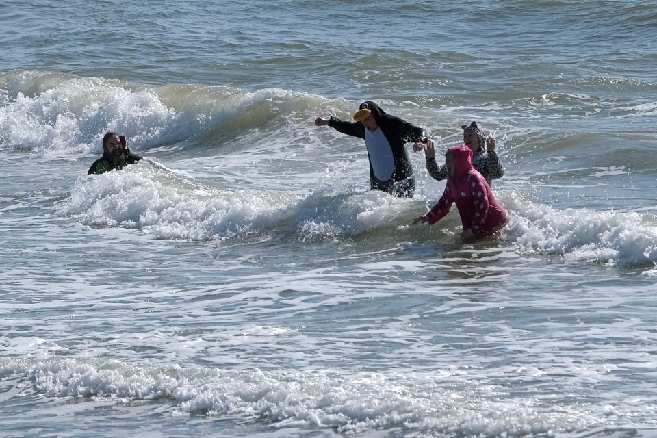 Swimmers getting into the holiday spirit in the sea at Bournemouth