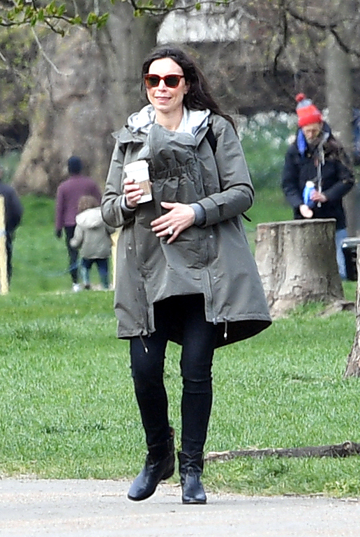 Christine kept baby Freddie close to her as they strolled around the capital