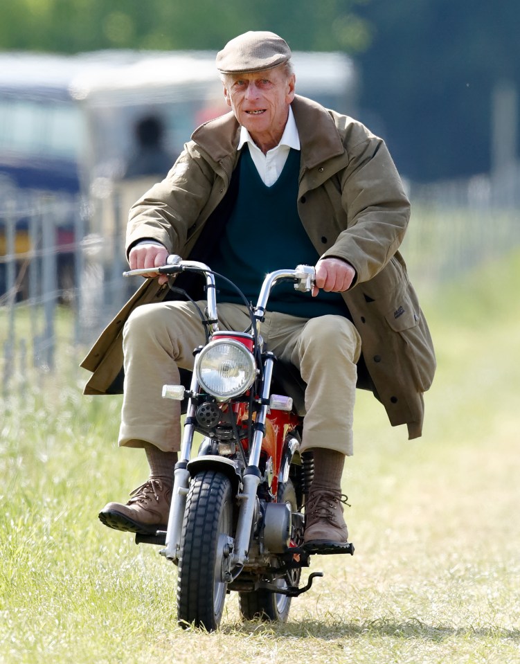 Prince Philip riding a mini 'Easy-Rider' motorbike at the Royal Windsor Horse Show