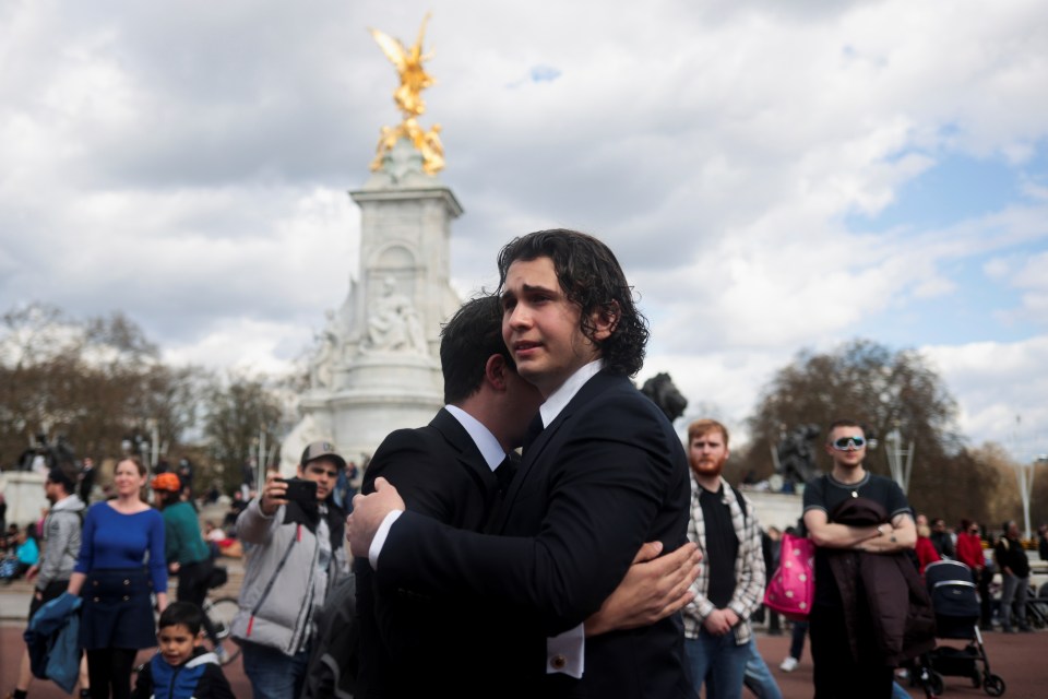 Mourners consoled each other outside Buckingham palace