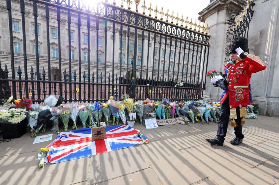 Flowers are left outside Buckingham Palace following the death of Prince Philip