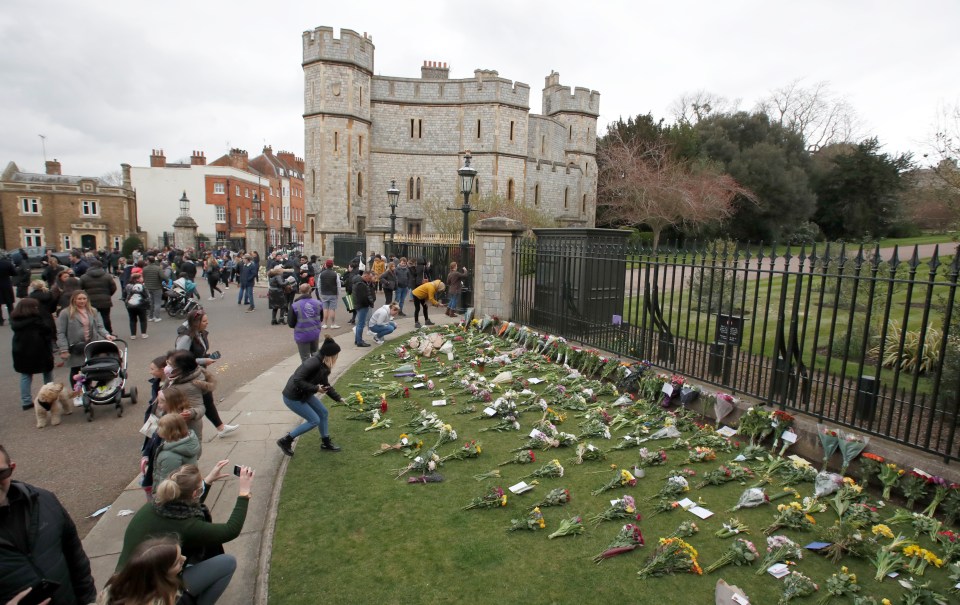 Hundreds of people flocked to Windsor Castle to lay flowers in the Duke's memory