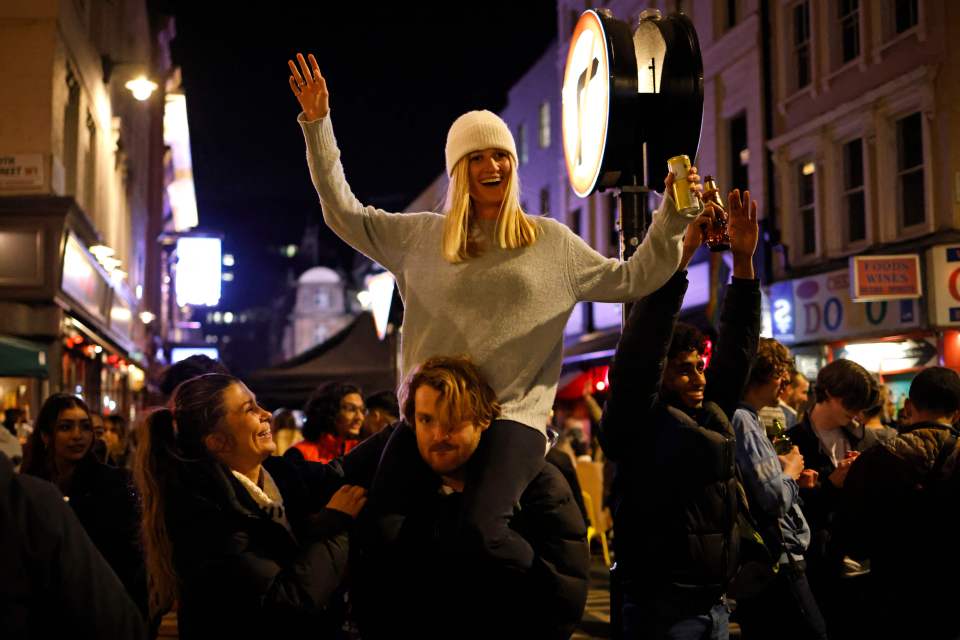 Drinkers have a street-side party in central London