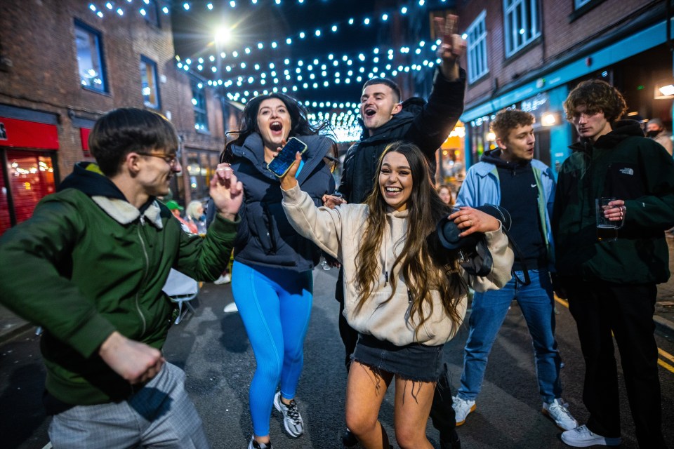 After boozers closed in Manchester, customers danced outside