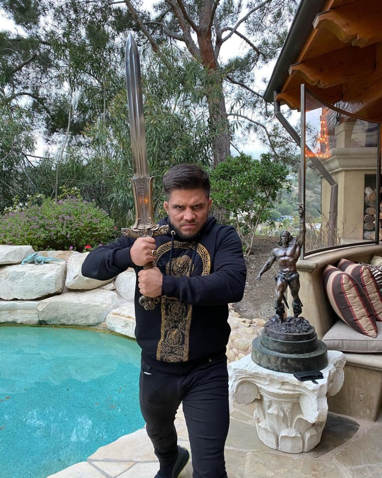 Henry Cejudo wields Arnold Schwarzenegger's sword