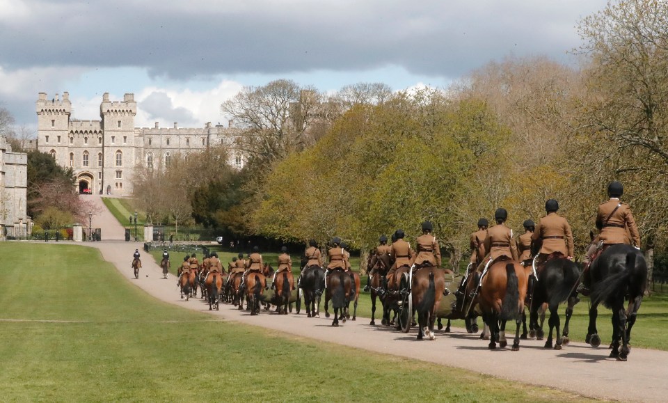 Members of The King's Troop Royal Horse Artillery rehearse on the Long Walk in front of Windsor Castle