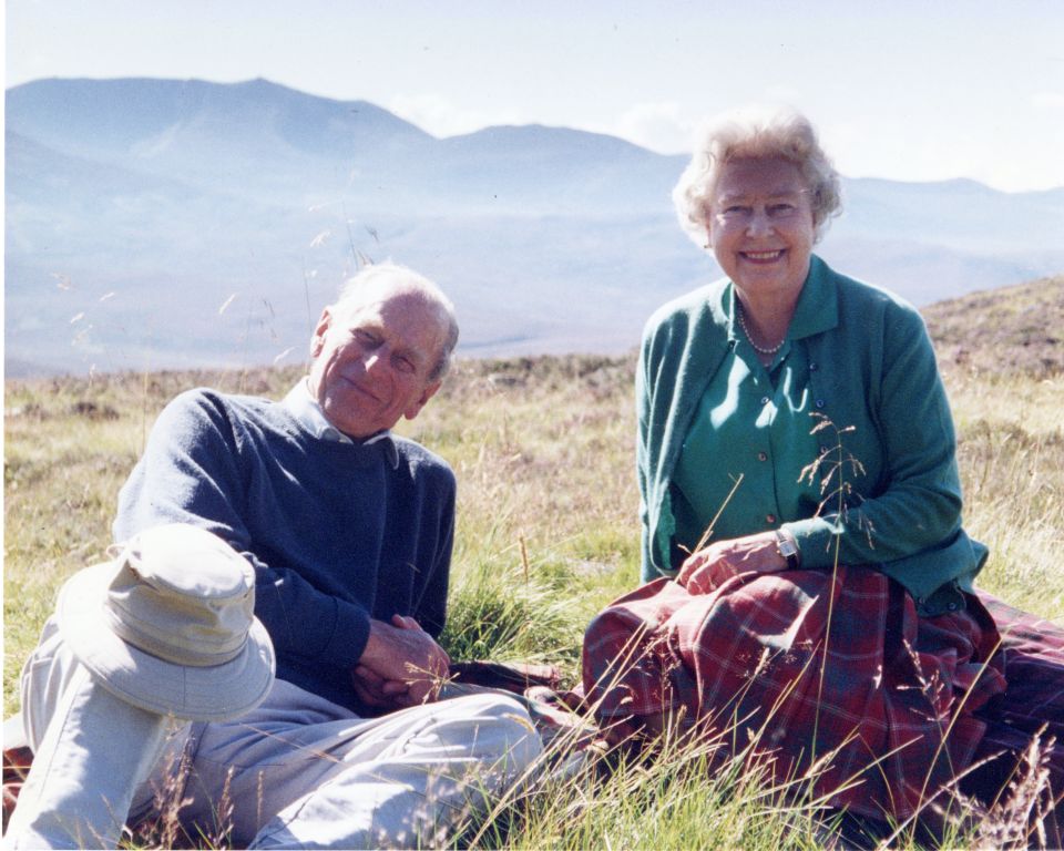 The Queen can be seen relaxing with her husband Prince Philip in a photograph released the day before the Duke's funeral