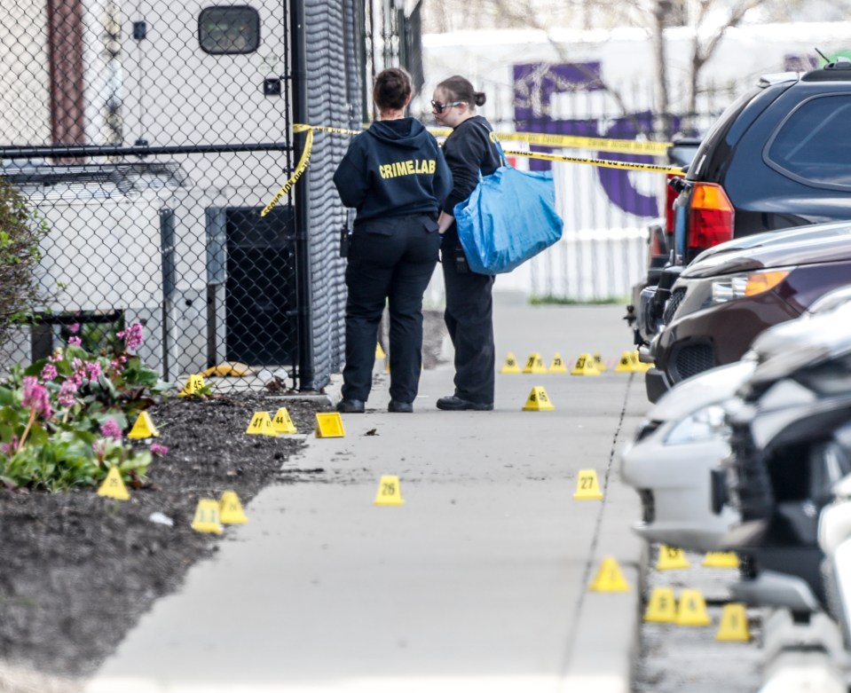 Investigators at the scene of the shooting in Indianapolis which saw eight people shot dead last week